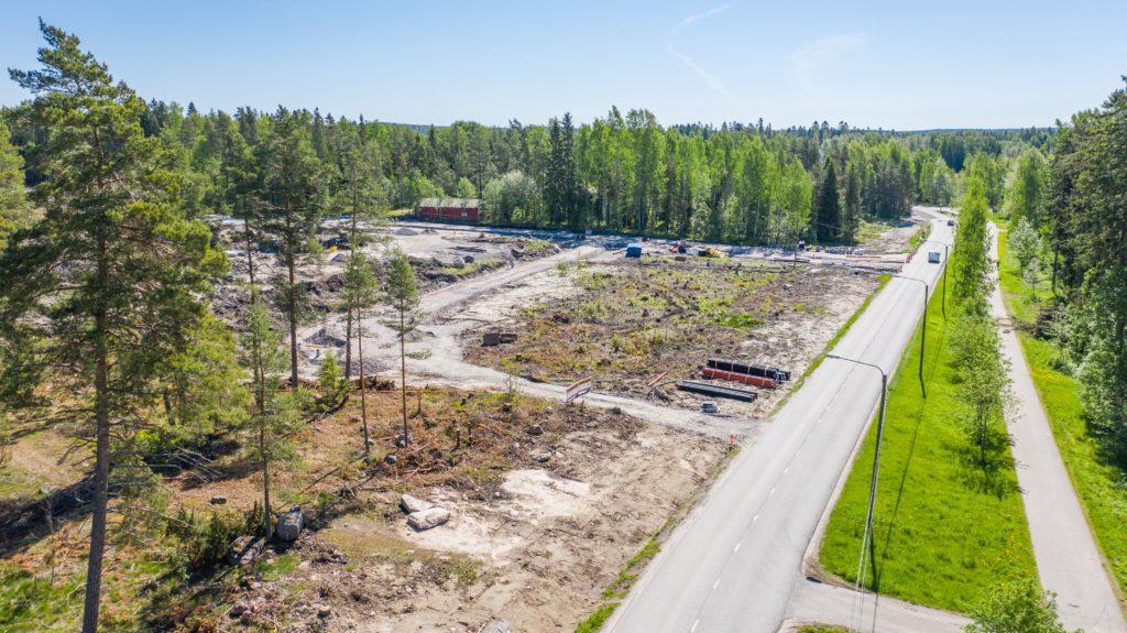 Haikostrandens småhusområde under uppbyggande med omgivande landskap, flygfoto.