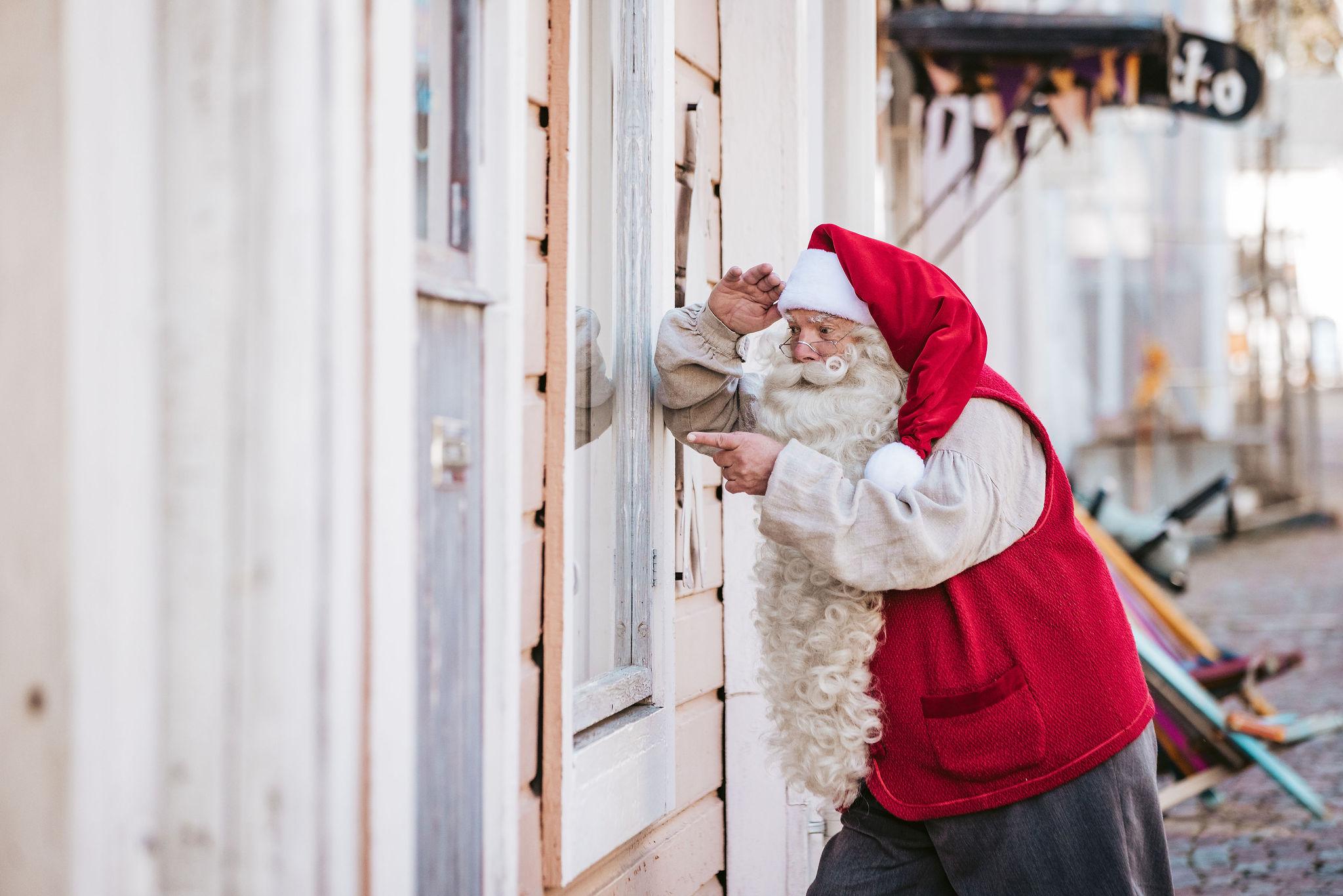 Santa peaking through a window